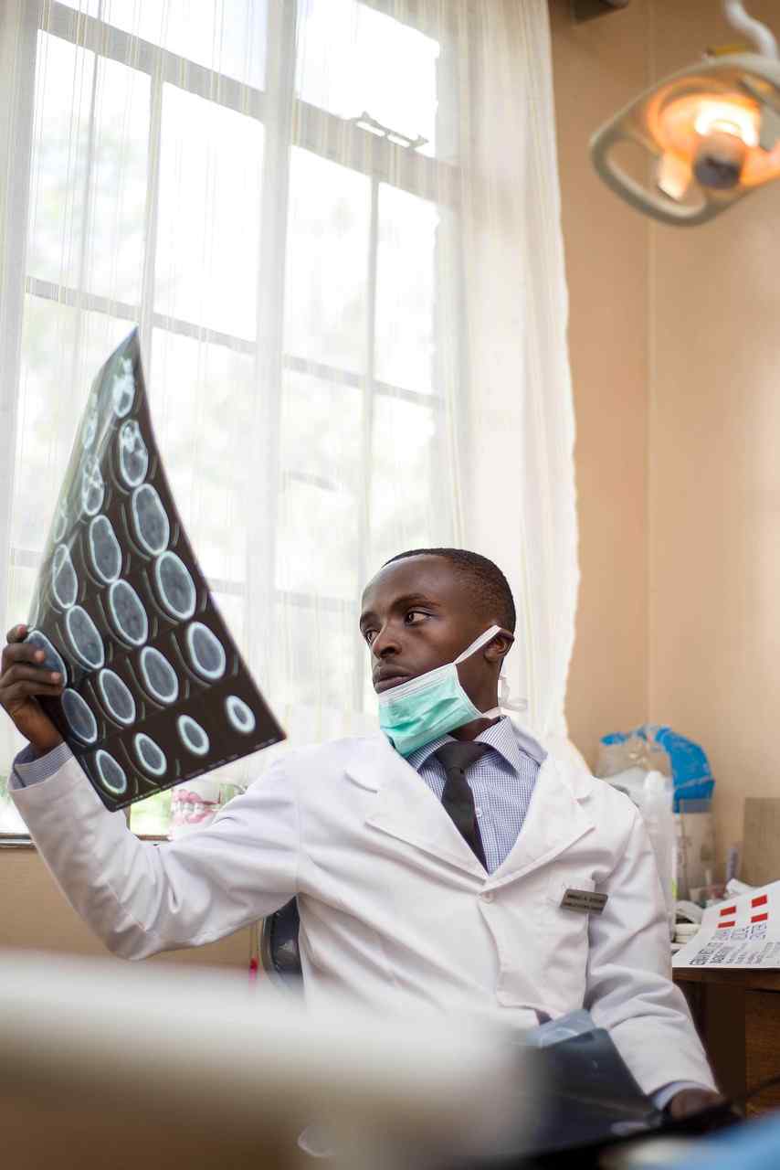 Dental professional reviewing diagnostic imaging in a modern clinic while exploring Dentist Loans Online, Dental Chair Financing, Dental Capital Solutions, Dental Automation Financing, and Orthodontic Practice Financing to expand and modernize a dental practice