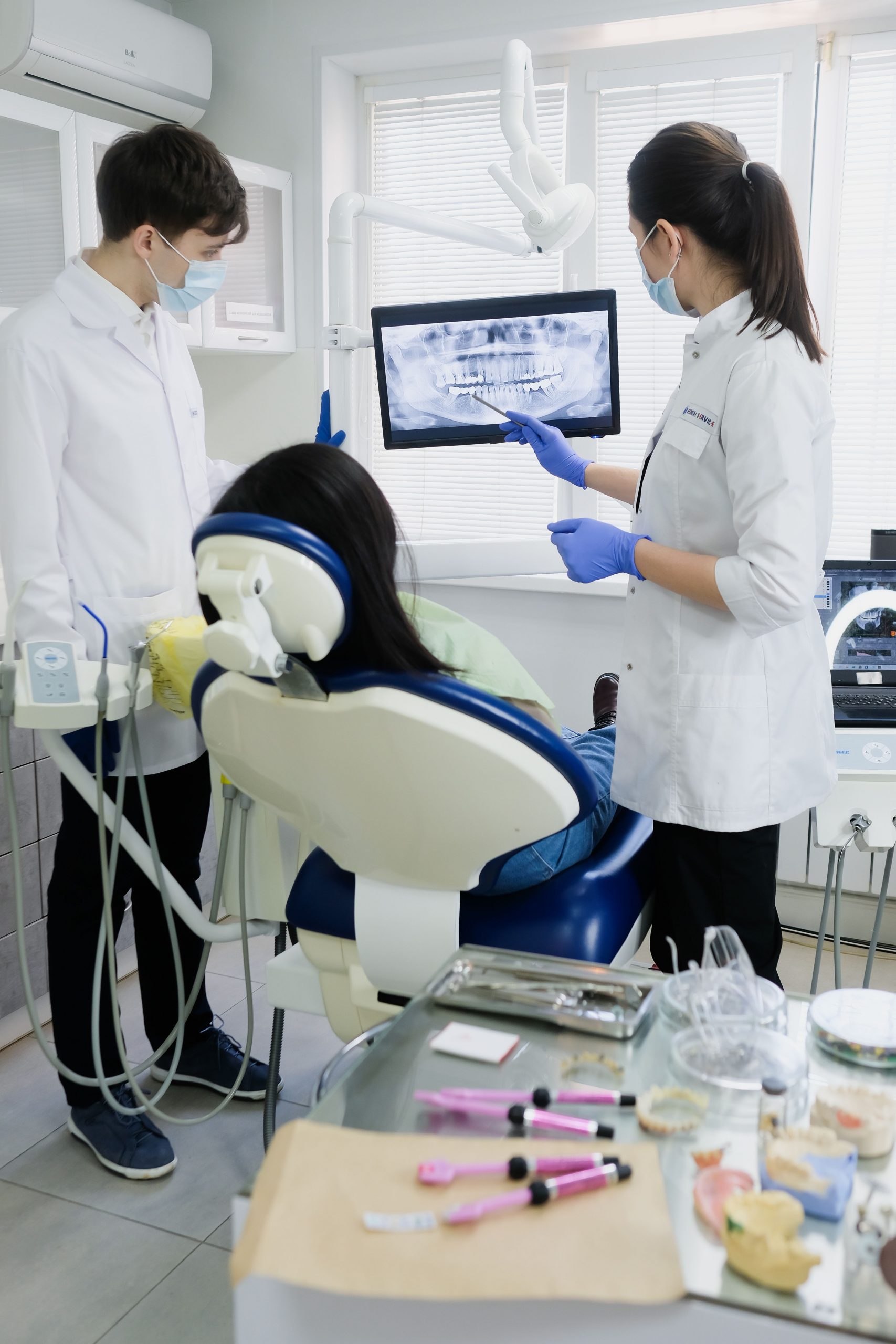 Dental consultation using digital imaging technology in a modern clinic, featuring patient treatment planning with panoramic X-rays and advanced equipment supported by Dental loans, dental succession planning financing, dental practice growth financing, oral surgery equipment financing, and implant equipment financing.